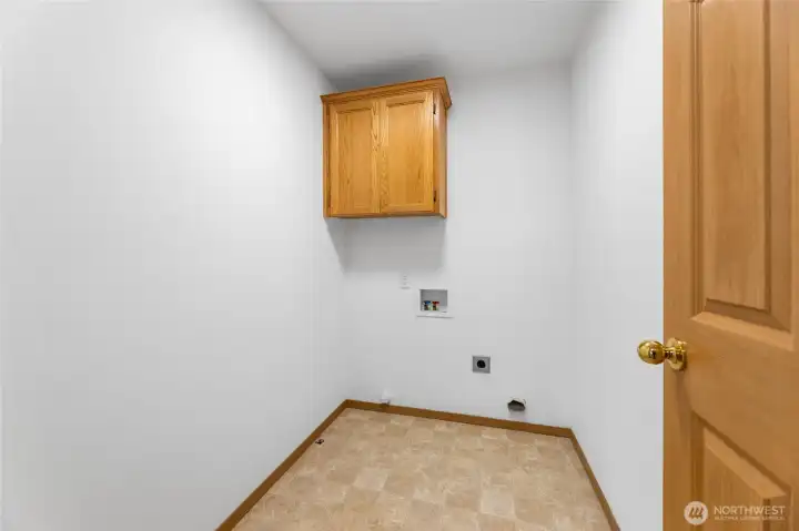 Laundry Room w/ cabinetry.