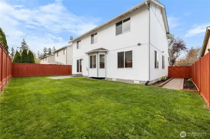 Enjoy pavers and space for a garden on the side yard. Home has gates on both sides.