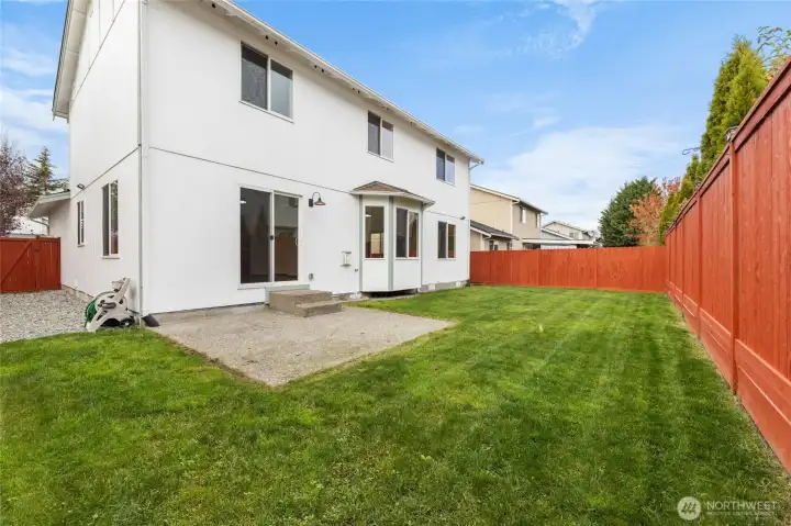 Large backyard with patio.