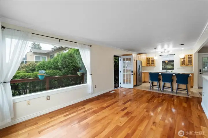 The door on the left leads out out to the front of the house or onto the wrap-around deck that will lead you to the water.