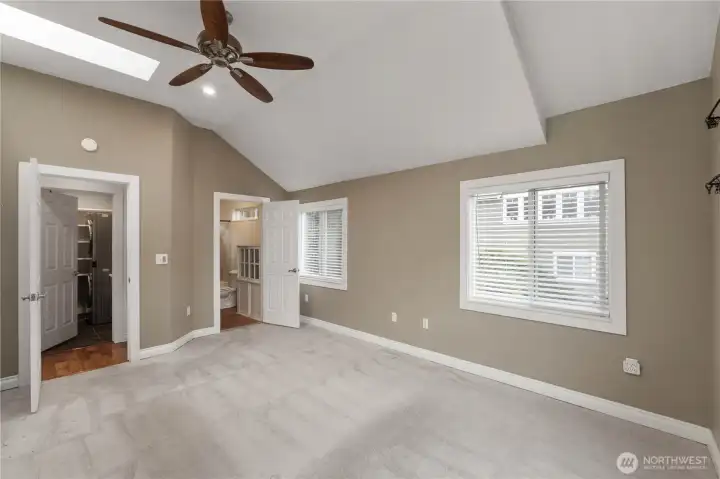 On the right side down the little hallway you'll find the large master with vaulted. ceilings