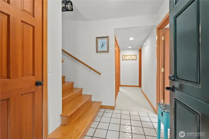 The inviting entrance and foyer, leading to the two large bedrooms, both with spacious en-suites. custom wood finishes throughout this home.