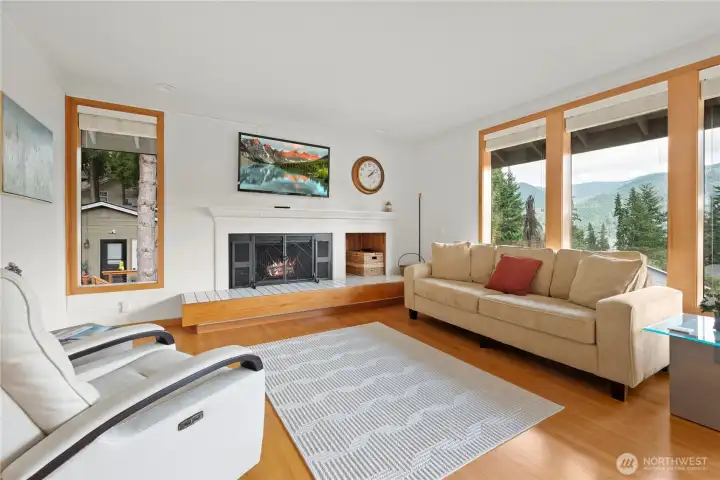 The beautiful wood fireplace and surround add elegance and atmosphere to this beautiful living room!