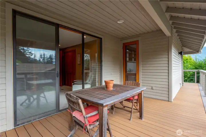 Fabulous new composite deck with a cable railing to emphasize the views! Slider leads to the bedroom/office on the main floor. The glass door opens to the kitchen.