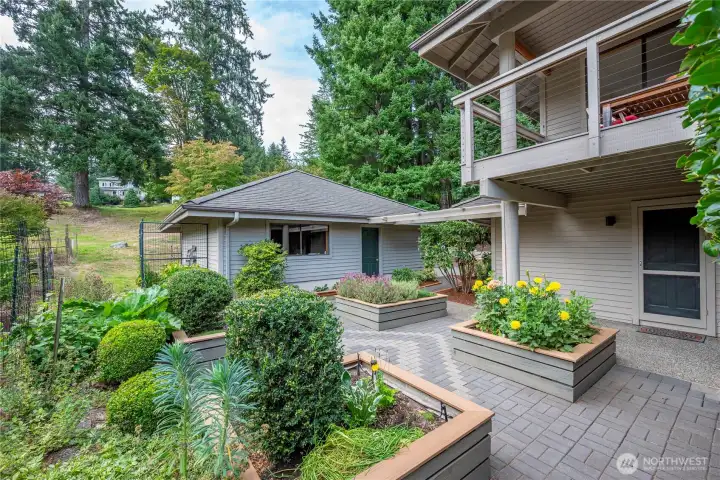 This charming sunny patio also has a fenced in area, at the back of the garage for further gardening adventures!