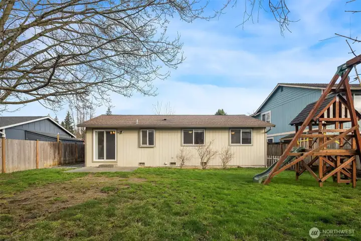 Large fenced backyard with large play sculpture.  Enjoy fresh blueberries from you own blueberry bushes.