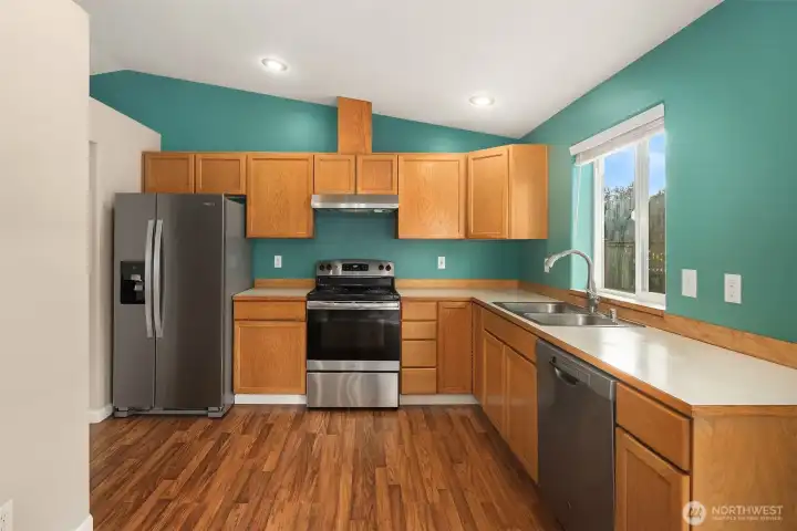 Warm kitchen with stainless steel appliances