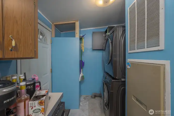 Laundry area + additional back entry towards garage/shop (Washer/Dryer not included)