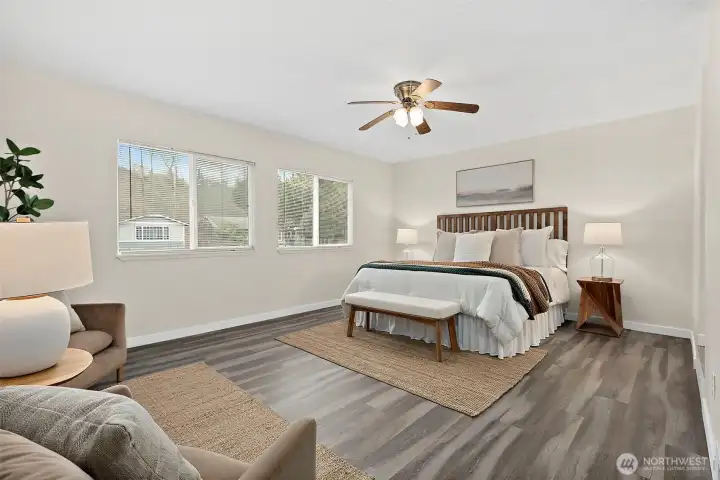 Step into the spacious primary bedroom to unwind from the day and snooze away. 2 large windows bringing in western light. Room features ceiling fan and brand new flooring, en-suite full bathroom and walk-in closet.