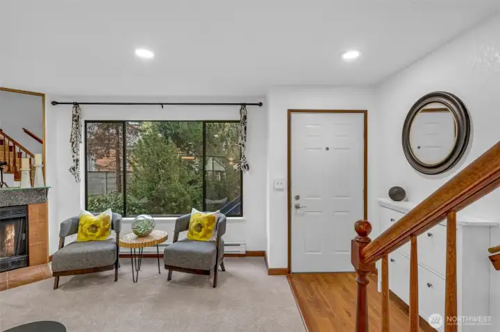 Entry features new can lighting and hard surfaces to help keep you newly installed carpet clean. The interior was recently painted and the wood burning fireplace makes a great focal point.