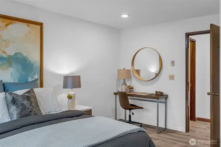 The primary bedroom faces west and get lots of natural light. Luxury vinyl plank flooring, new base molding and lighting.  Attached three quarter bath with walk in shower.  The two upper bedrooms are generously sized with room for desks or sitting areas.