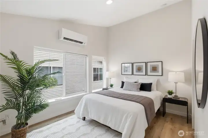 Master bedroom: Upper-level bedroom featuring vaulted ceilings and abundant natural light.