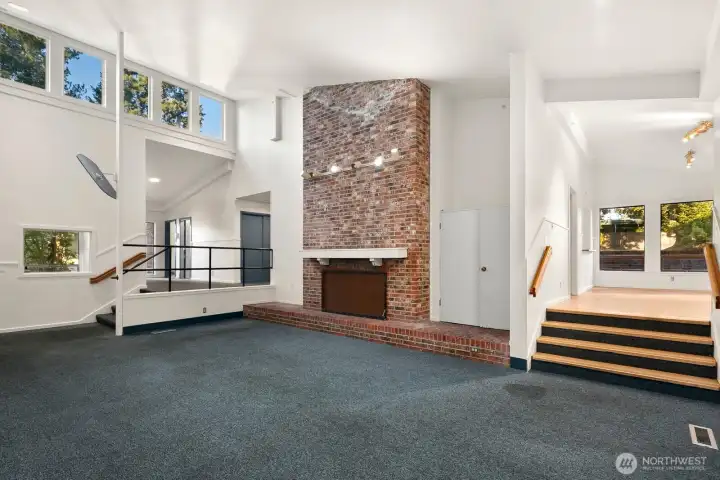 Light filled living room with wood fireplace
