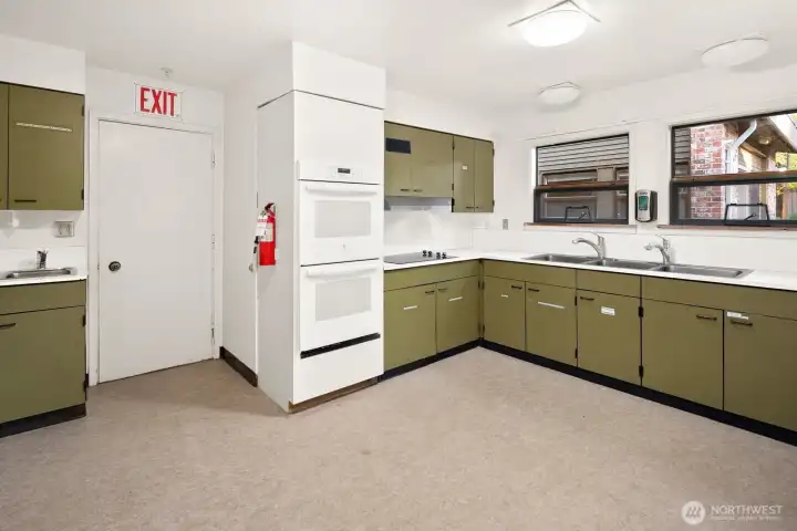 Kitchen features double ovens and  built in cooktop