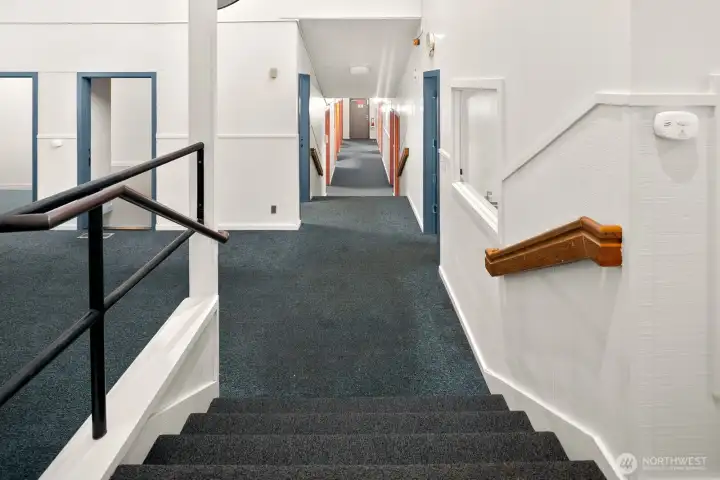 Stairs to mid-level gathering rooms.