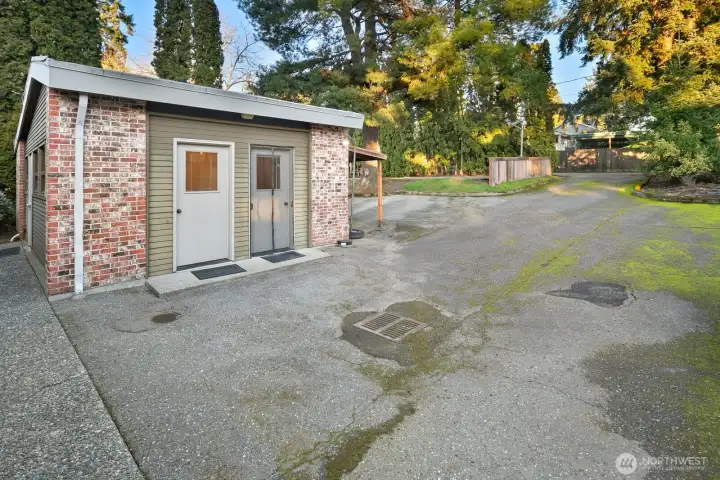 Three offices and a half bath in this heated outbuilding. The east side property line is on the right side of this building. A shared easement driveway leads to rear parking spaces.