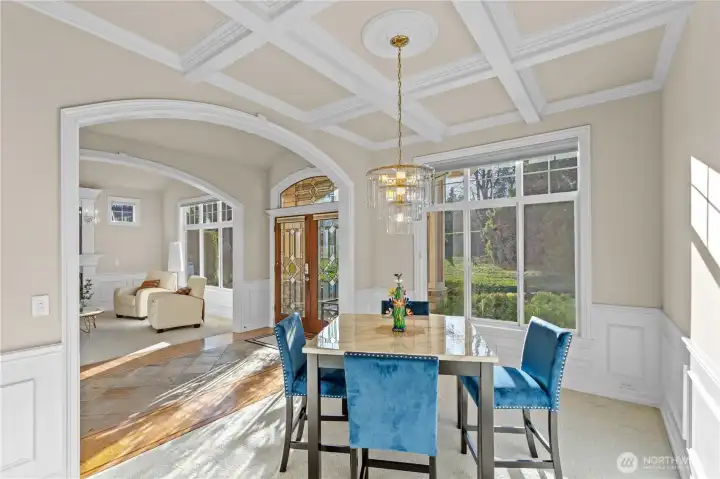 Spider beam ceilings and large windows make this dining room a statement