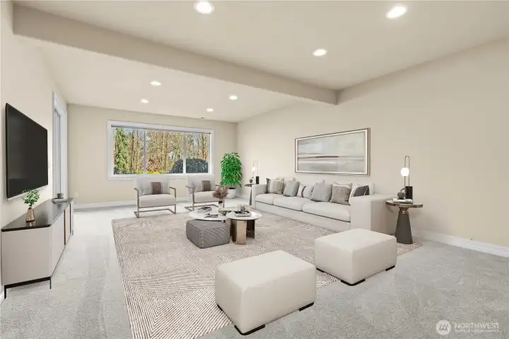 Virtually staged, this lower level family room is designed to sit and relax.  Wonderful flex space to have a movie night or watch the game!  Mostly 9 foot ceilings in this daylight filled space