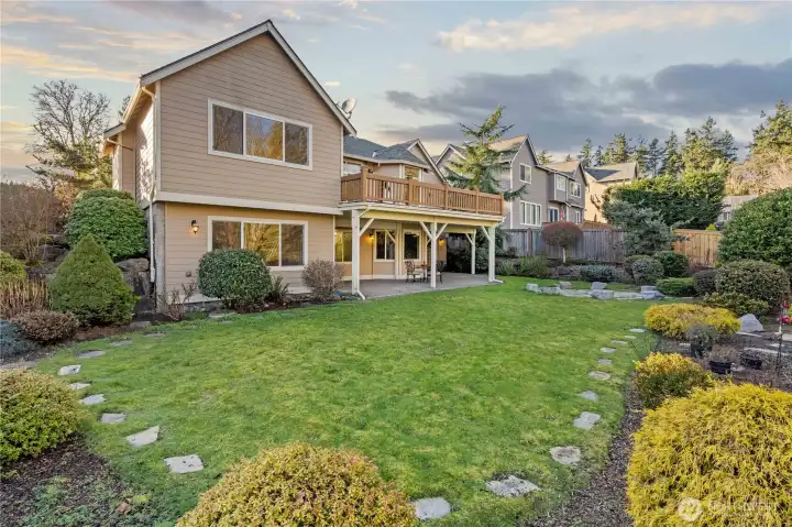 Simply lovely back yard with over 50 shrubs and trees!