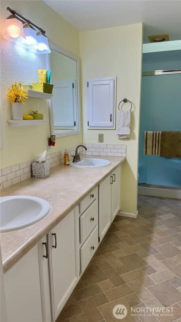 Updated 3/4 primary bath with storage closet!