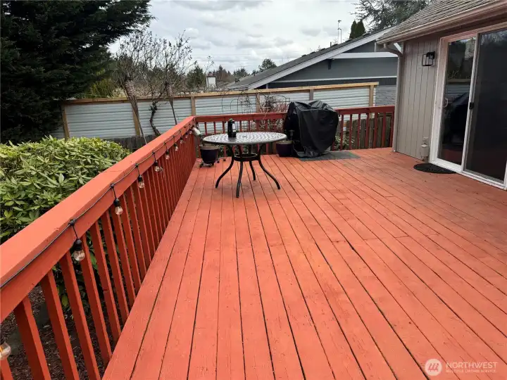 Standing in yard facing deck that was built for entertaining and relaxing!