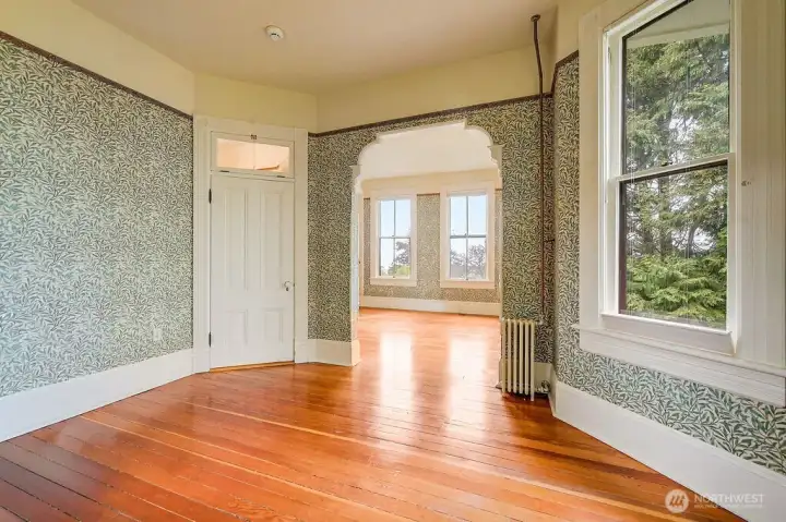 Take notice of this archway leading to additional room where you'll be in awe of the views of Puget Sound.