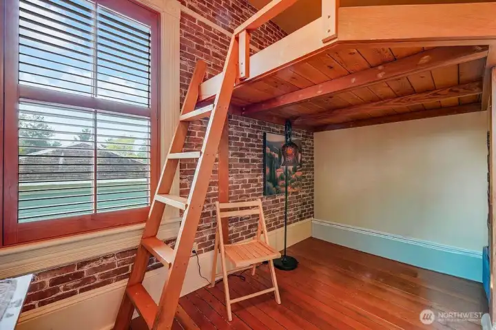 Upper level room with views, a ladder-access sleeping area, and access to additional space above.