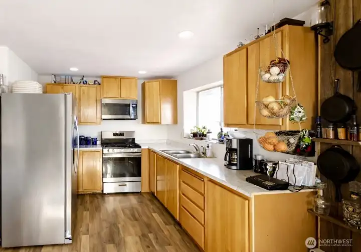 Bright kitchen with plenty of cabinet space and natural light.