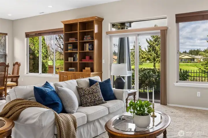 Generous living room with views of golf course