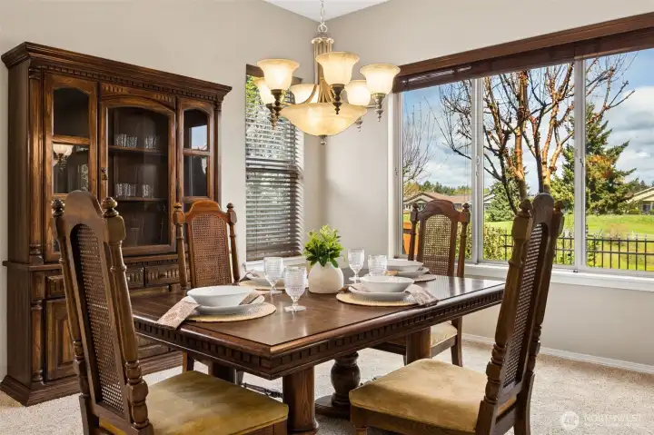 Formal dining room with views of golf course