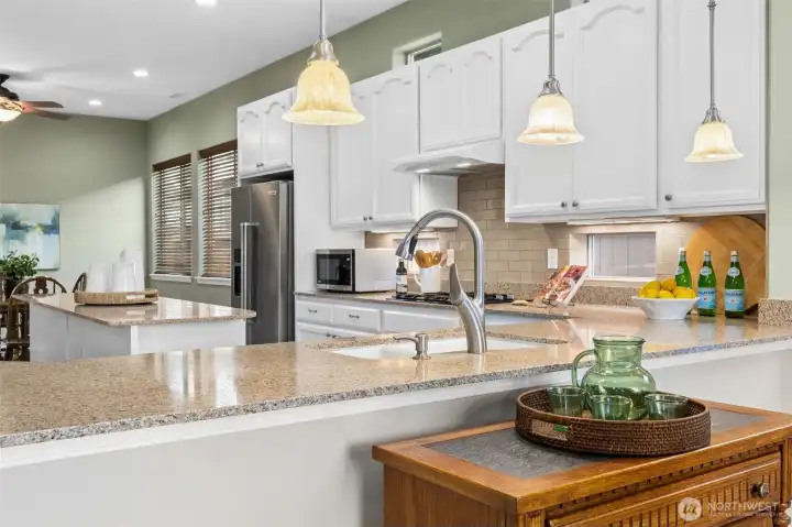 Open concept kitchen with quartz counters