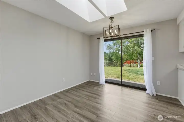Skylights in dining area bring in plenty of natural light...