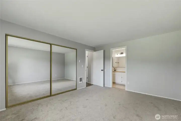 Primary bedroom ensuite ... All bedrooms feature new comfortable carpet!