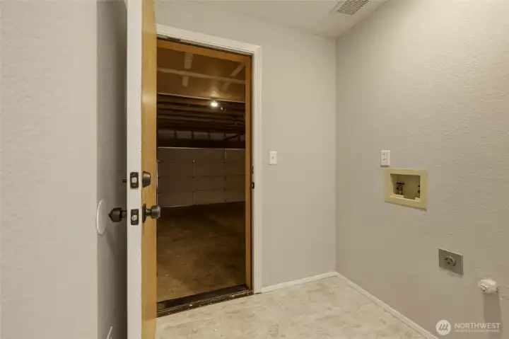 Designated utility room between house and garage.