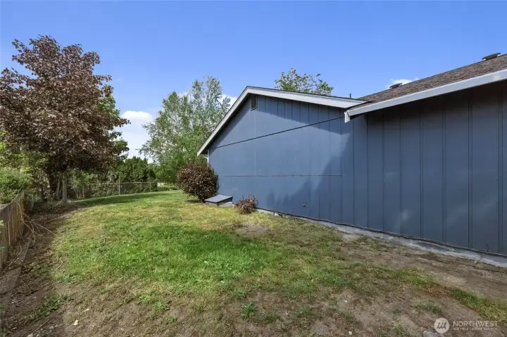 Side yard (same side as garage).