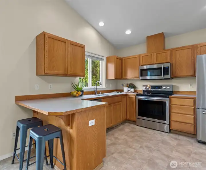 Features stainless newer steel appliances