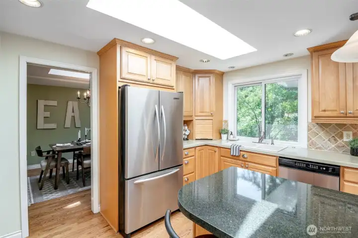bright and light kitchen overlooks your backyard
