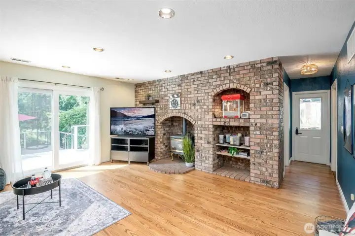 gas fireplace flanked by beautiful brick enclosure