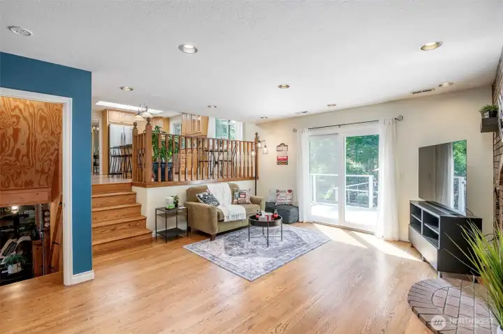Used as a media room, this space ties together the downstairs and upper deck
