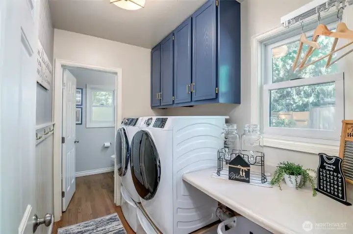 Laundry wisely located off garage and side access door. W/D stay!