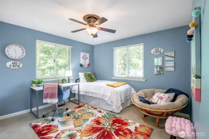 Bedroom #2 overlooks the street but offers fir tree western exposure as well