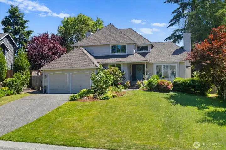 Long driveway, big front yard and a stately home