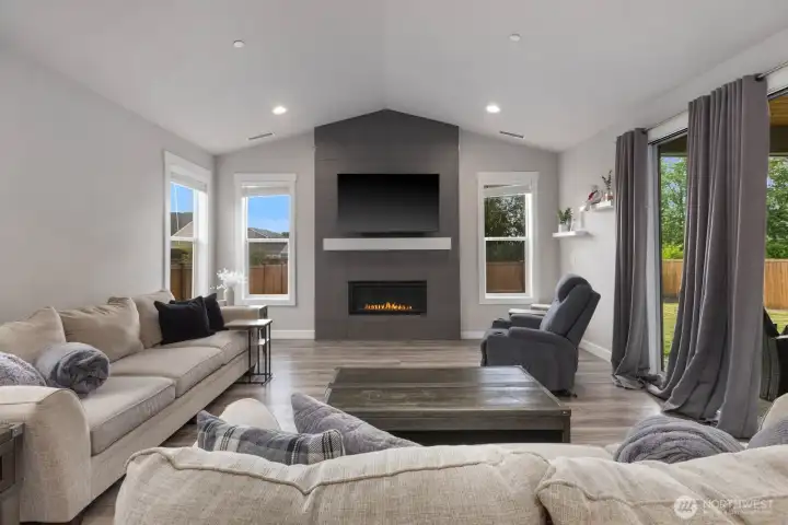 Fireplace wall extends from floor to ceiling