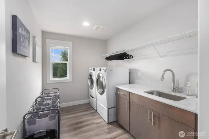 Utility room upstairs with sink and plenty of storage