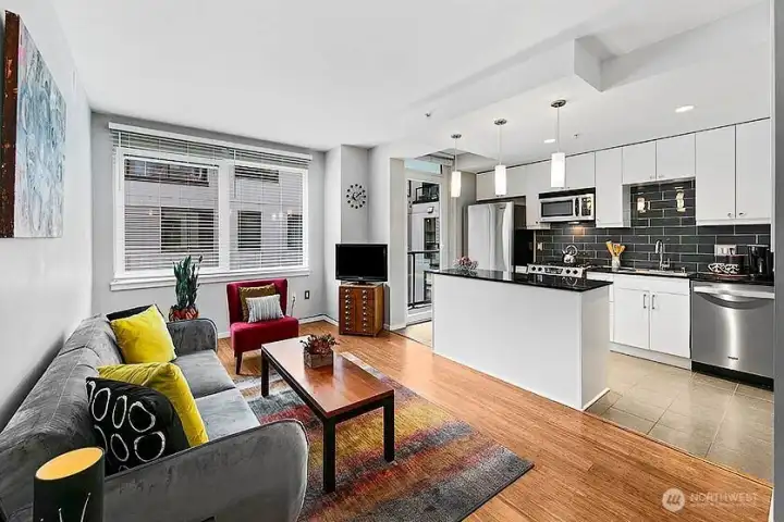 Cute great room with easy entertaining access to the open concept kitchen and deck. Cute great room with easy entertaining access to the open concept kitchen and deck.