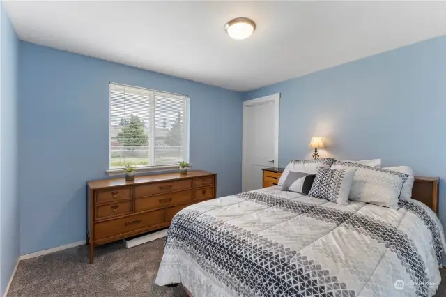One of the spacious bedrooms with walk-in closet.