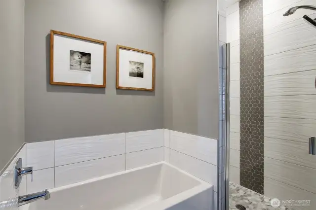 Soaking tub and separate shower.