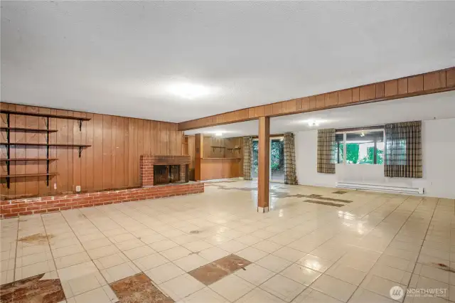 This bonus room is huge. With its bar area and fireplace you can make this into a great entertainment space. Step outside on the patio on a hot summers day and stay cool.