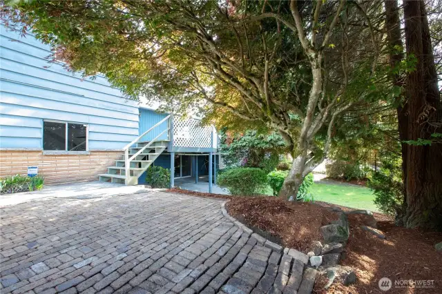 The side yard has several levels and provides a green space to enjoy.