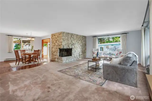 The focal point of the living room is the large quarry stone fireplace.